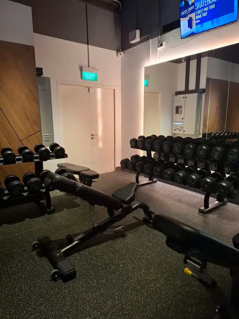 Dumbbell rack with benches fixed in an inclined position at Yishun East A row of brand new treadmills located in Anytime Fitness Yishun East run by the ReFormd Group