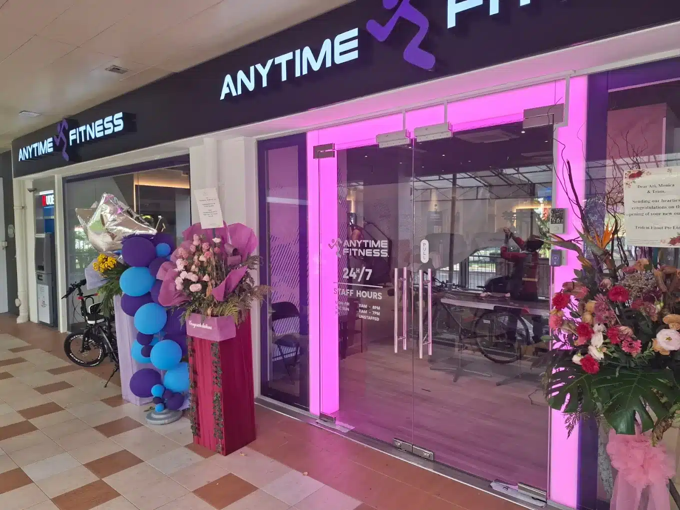 Entrance of Anytime Fitness Yishun East Functional Area of Anytime Fitness Yishun East which is run by the ReFormd Group during opening with congratulation bouquet of flowers outside the unit