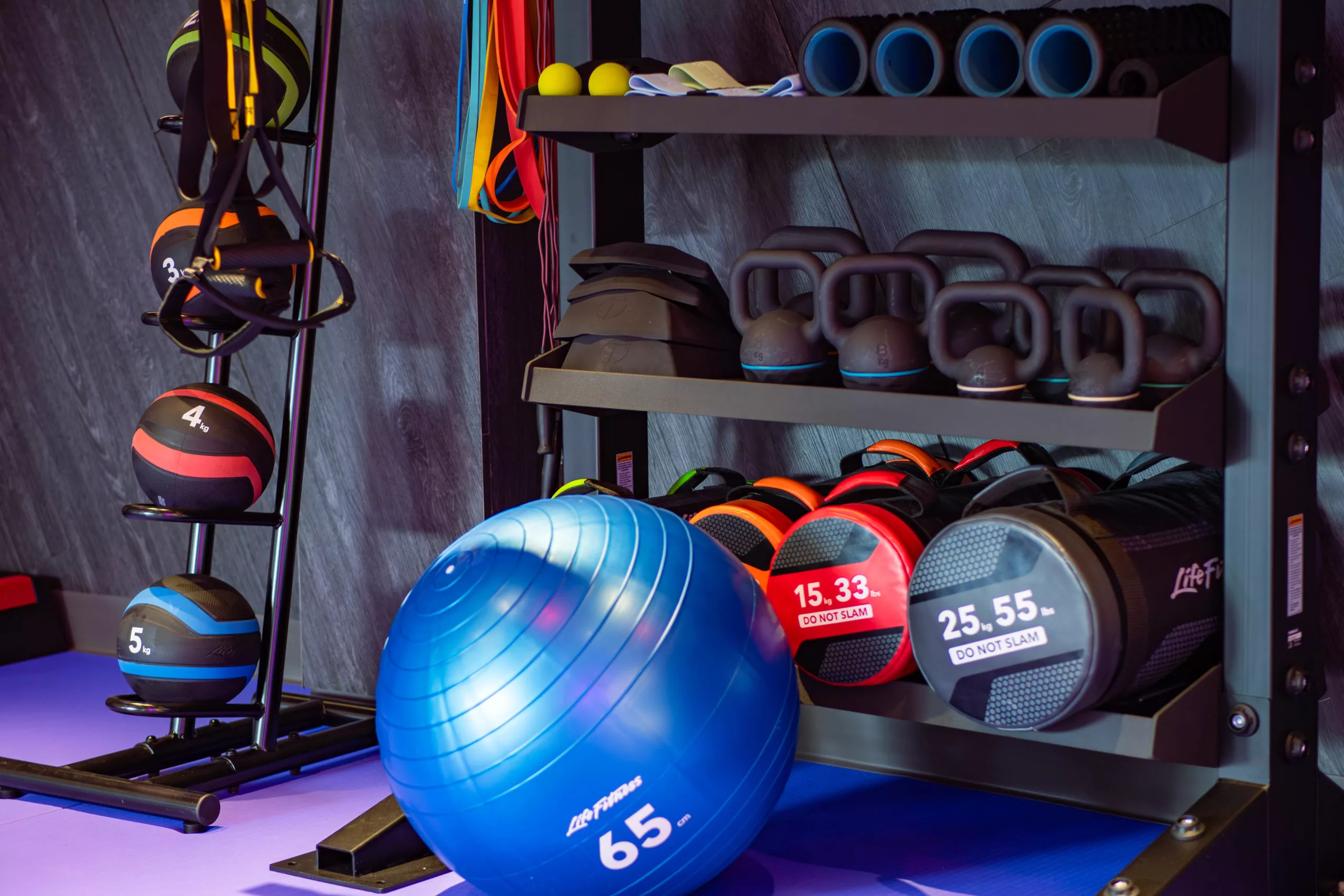 Functional Area at Anytime Fitness New Queensway. Extensive amount of equipment such as medicine balls, an exercise ball, core bag, kettlebells, foam rollers and massage balls are present