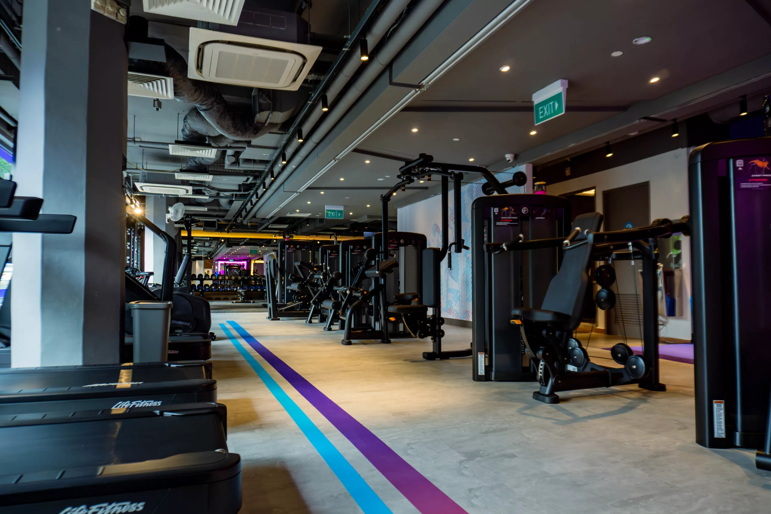 Anytime Fitness New Queensway walkway between treadmills and machines